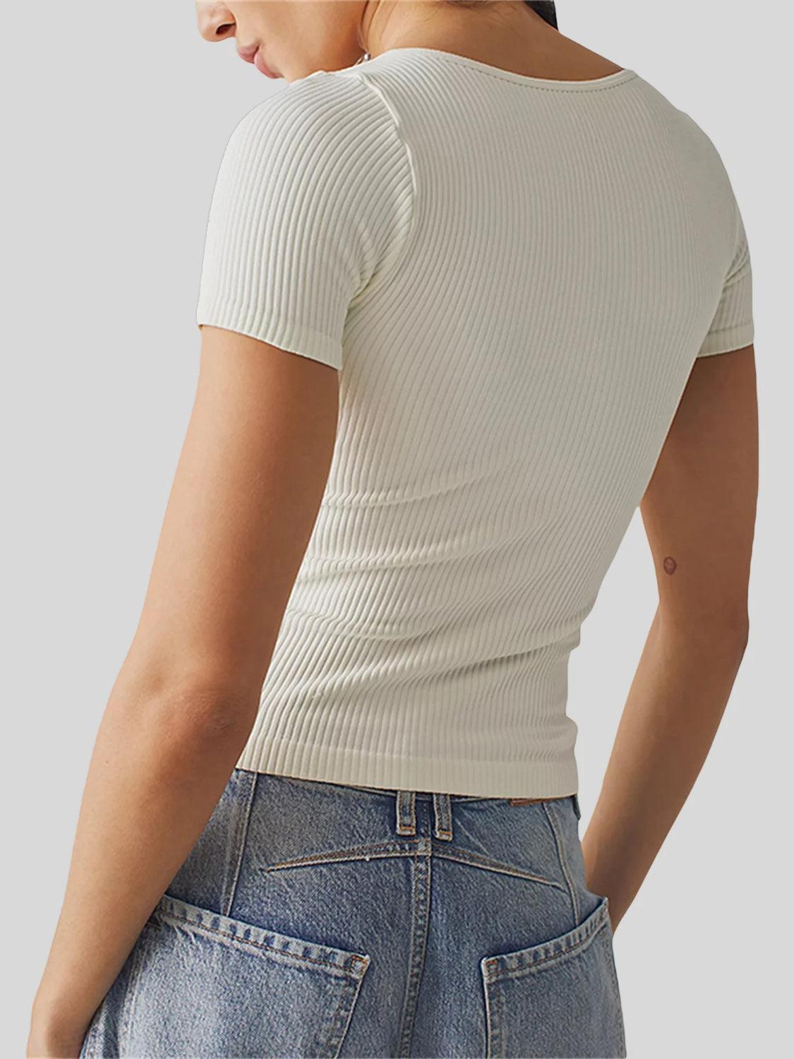 the back of a woman wearing a white top