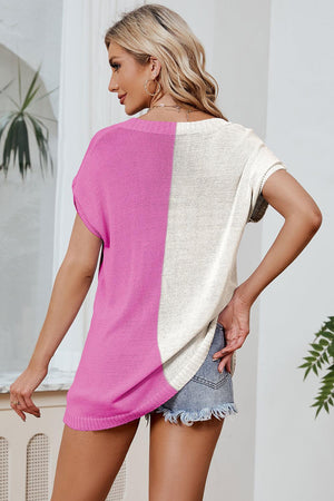 a woman wearing a pink and white sweater