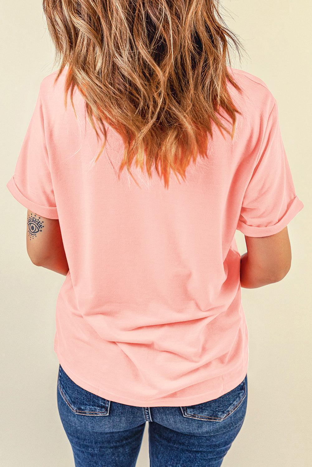 a woman with long hair wearing a pink shirt