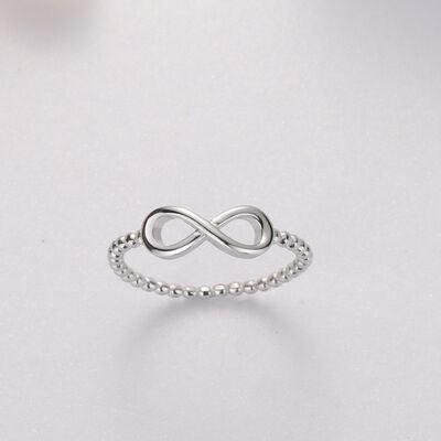 a white gold ring with a twisted design