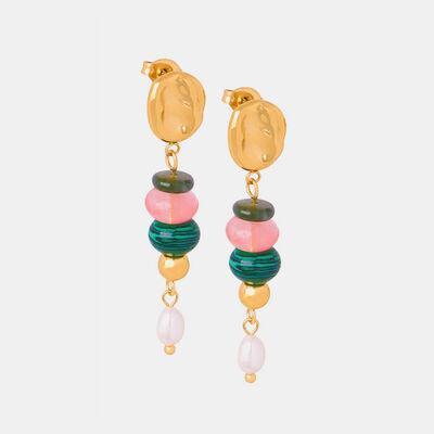 a pair of earrings with beads hanging from them