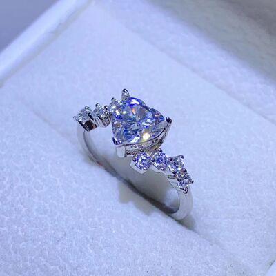 a ring with a cushion cut diamond in a box