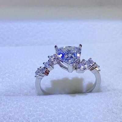 a white gold ring with a princess cut diamond