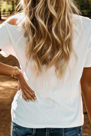 a woman with long hair wearing a white shirt