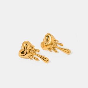 a pair of gold earrings on a white background