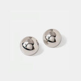 a pair of silver earrings on a white background