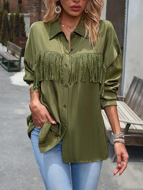 a woman wearing a green shirt and jeans