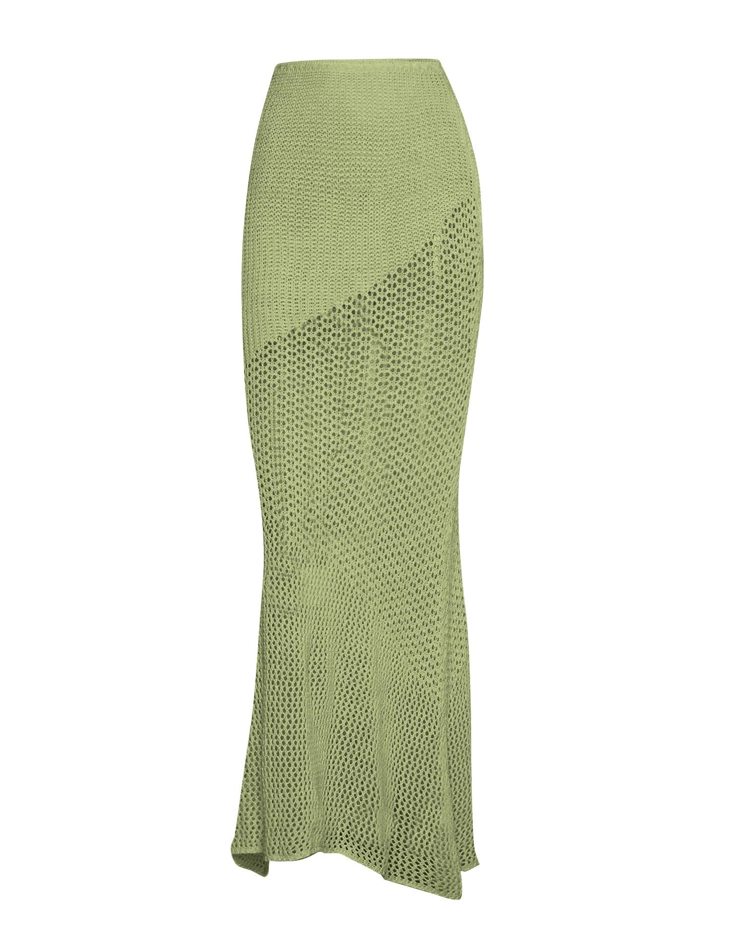 a woman in a green knitted skirt