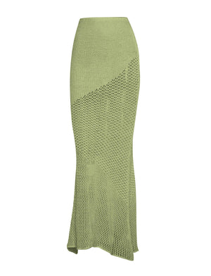 a woman in a green knitted skirt