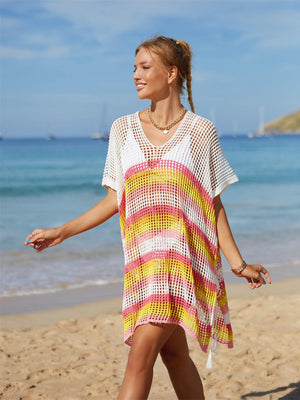 a woman is walking on the beach with a frisbee