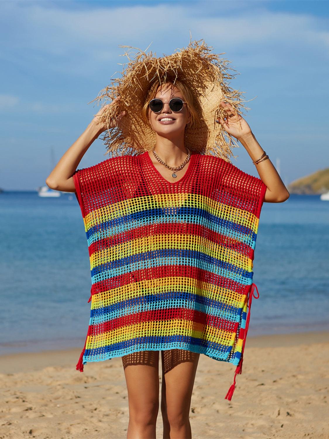 a woman standing on top of a sandy beach