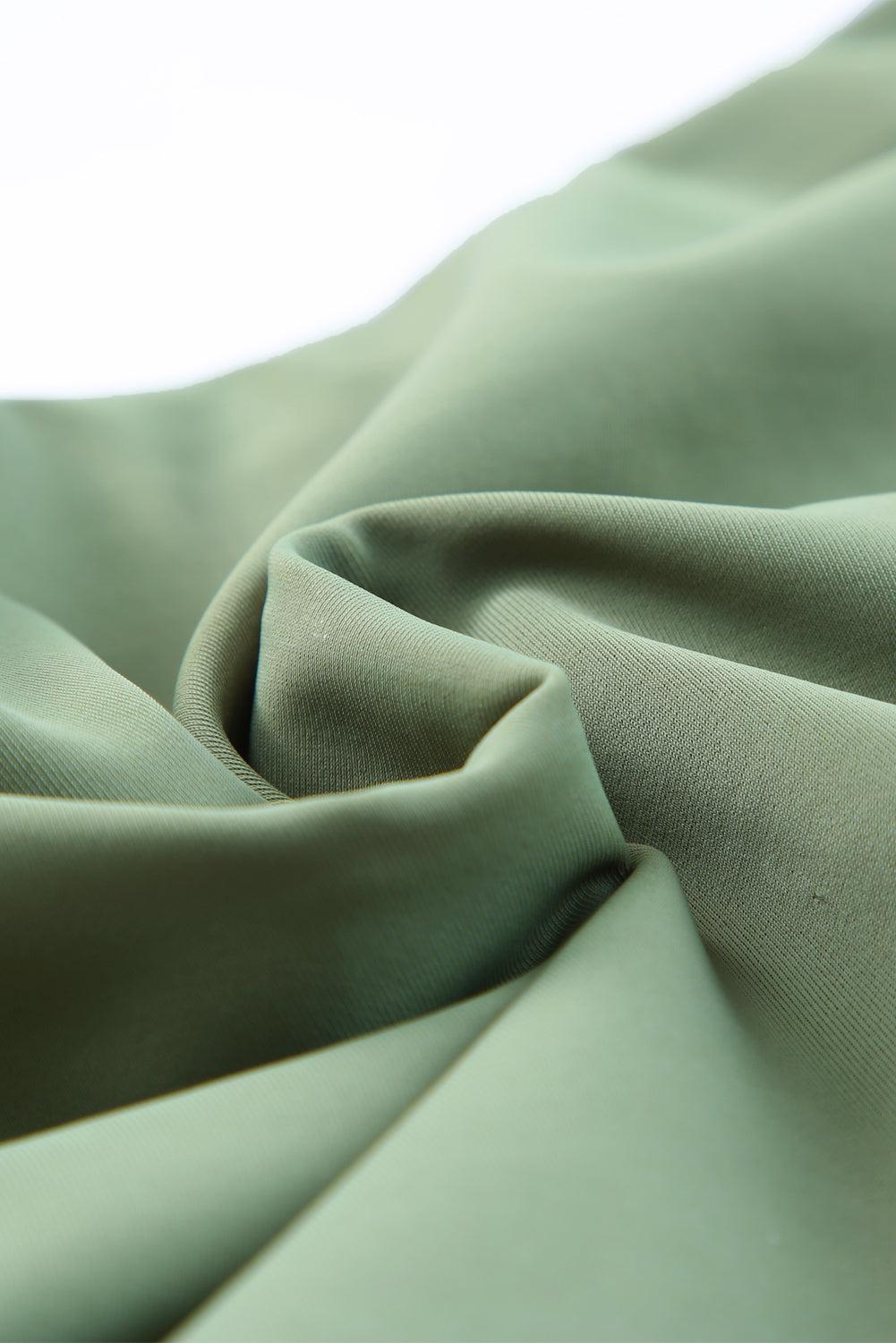 a close up view of a green fabric