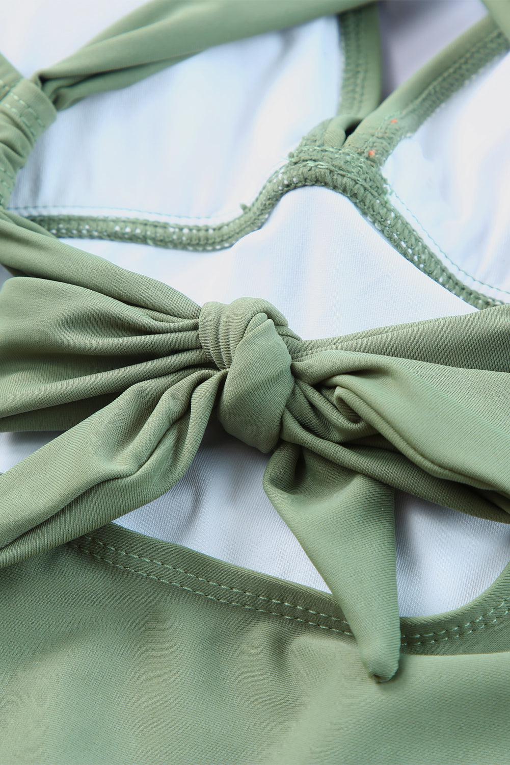 a close up of a bra with a knot on it