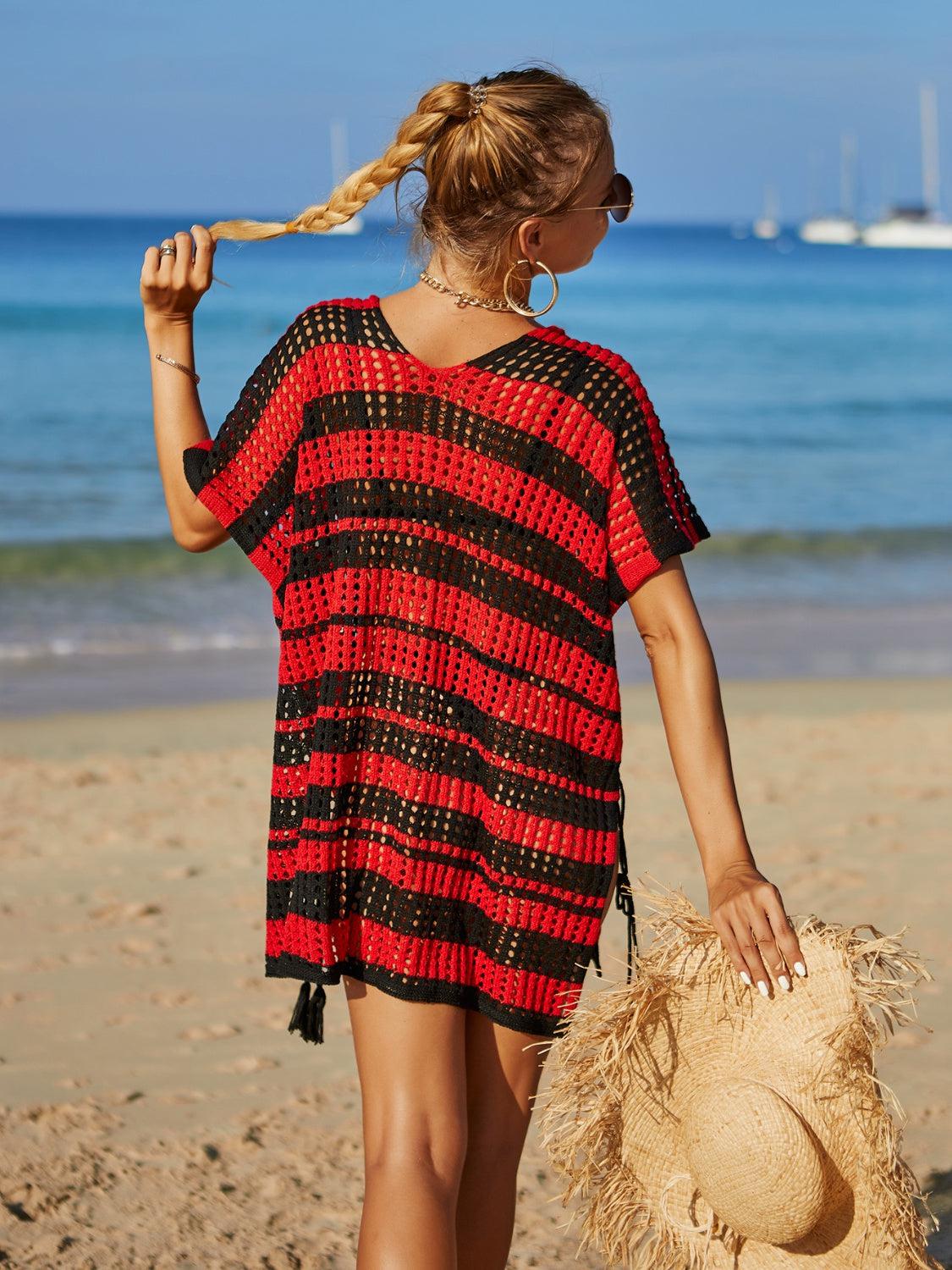 a woman walking on a beach with a straw hat