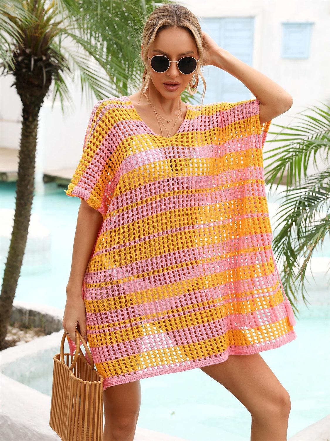 a woman wearing a yellow and pink crochet cover up