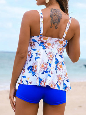 a woman with a tattoo on her back standing on a beach