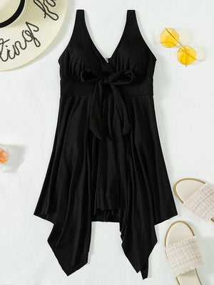 a women's black romper with a bow at the waist