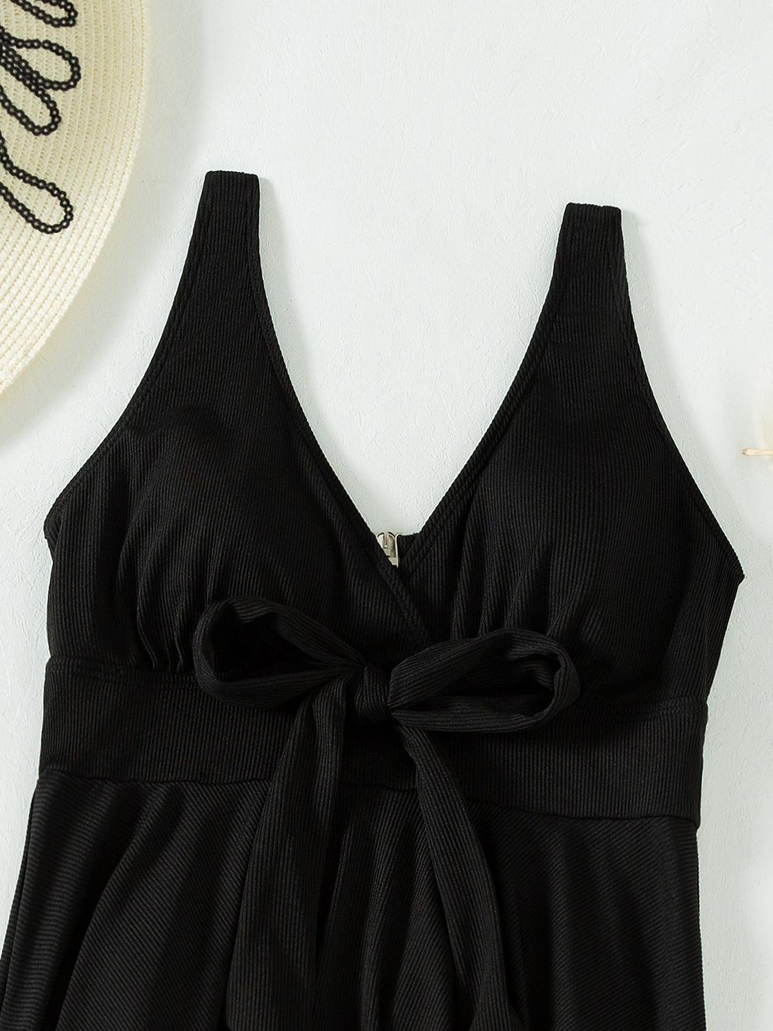 a black top with a bow on the front