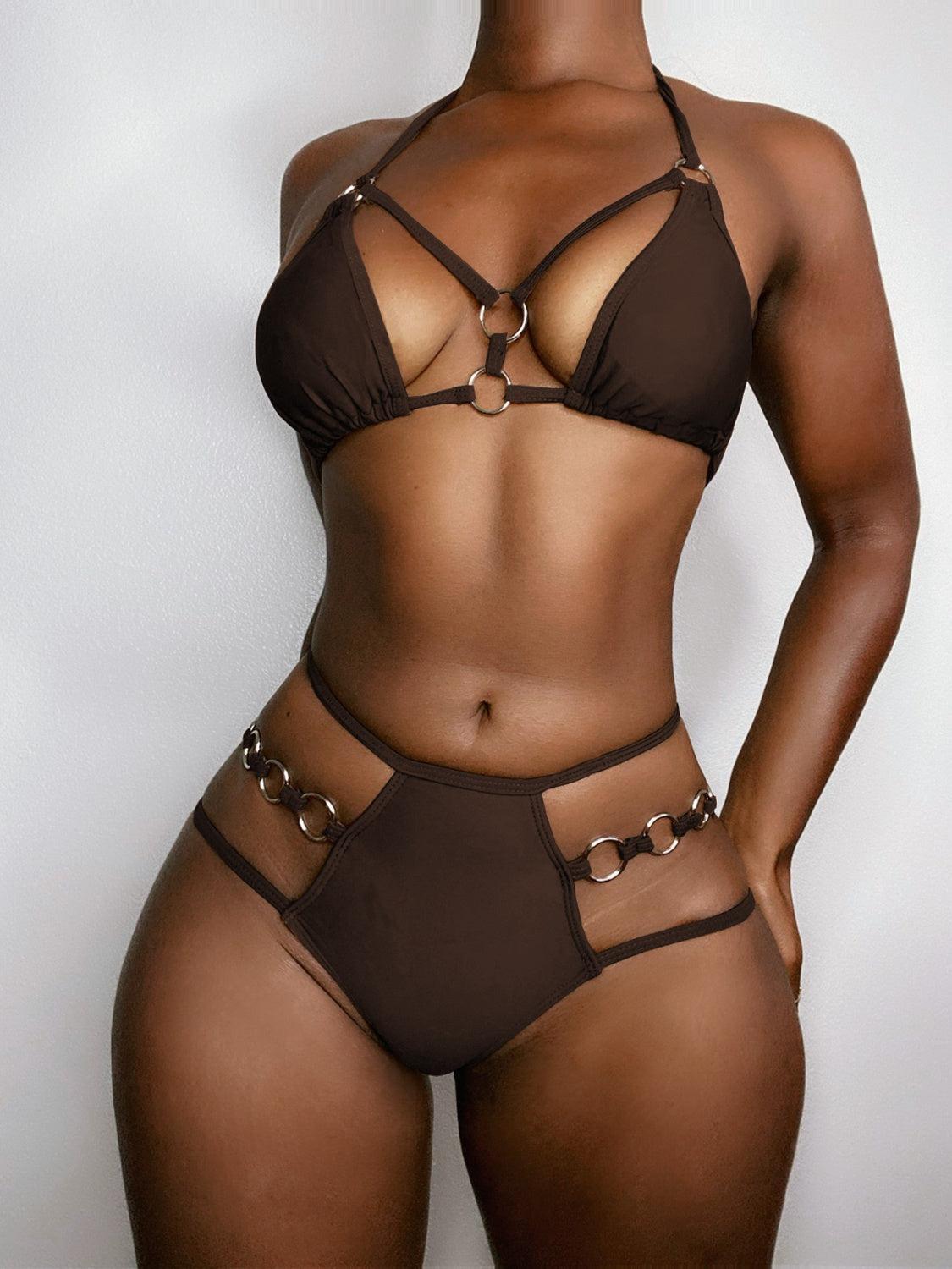 a woman in a brown bikini top and panties