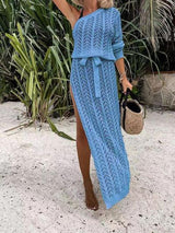 a woman wearing a blue knitted dress