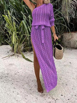 a woman wearing a purple knitted dress