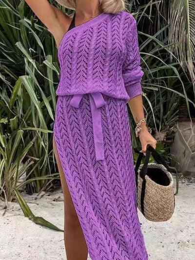 a woman in a purple dress and straw hat