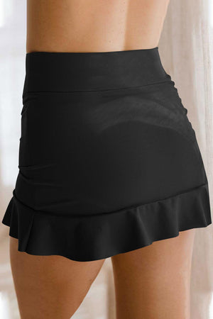 a woman wearing a black skirt and heels