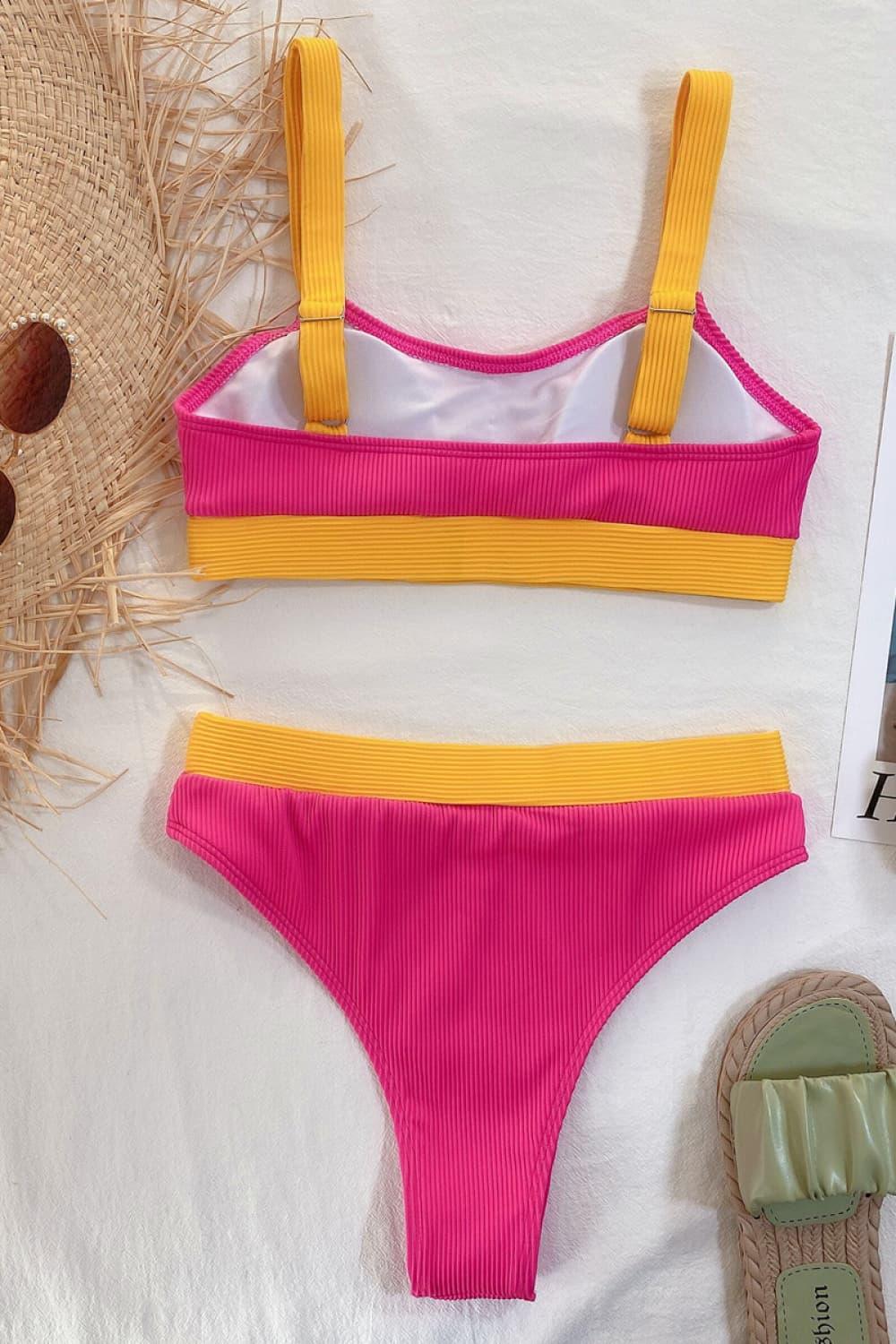 a woman's bikini top and bottom in pink and yellow