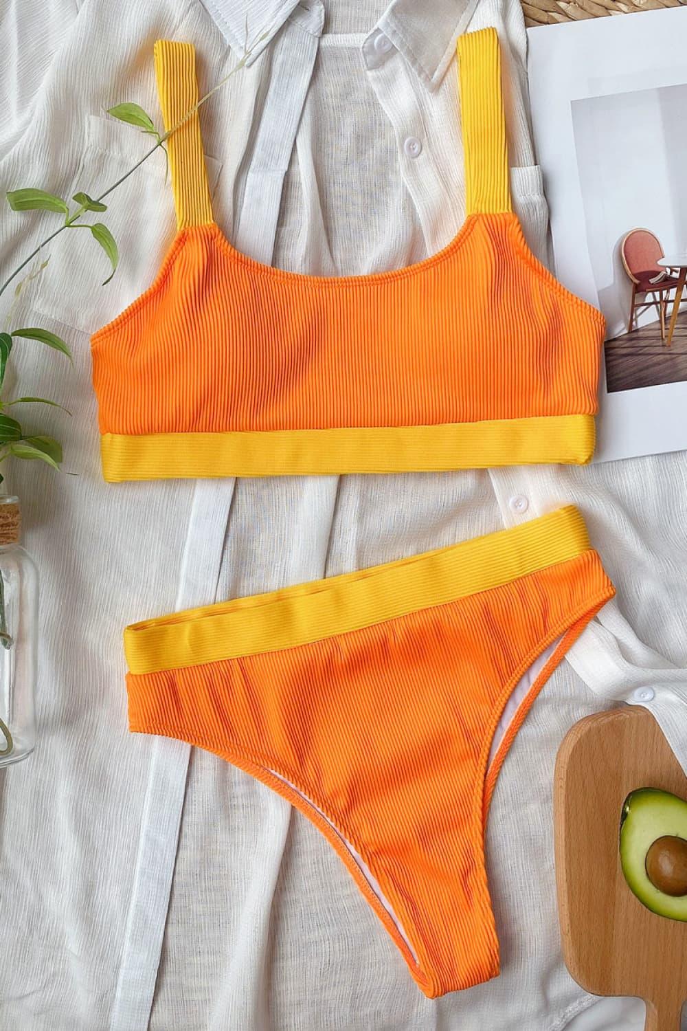 an orange and yellow bikini top and bottom with an avocado