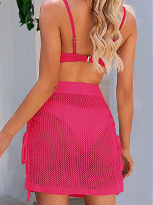 the back of a woman wearing a pink dress