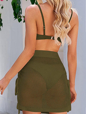 the back of a woman wearing a green dress