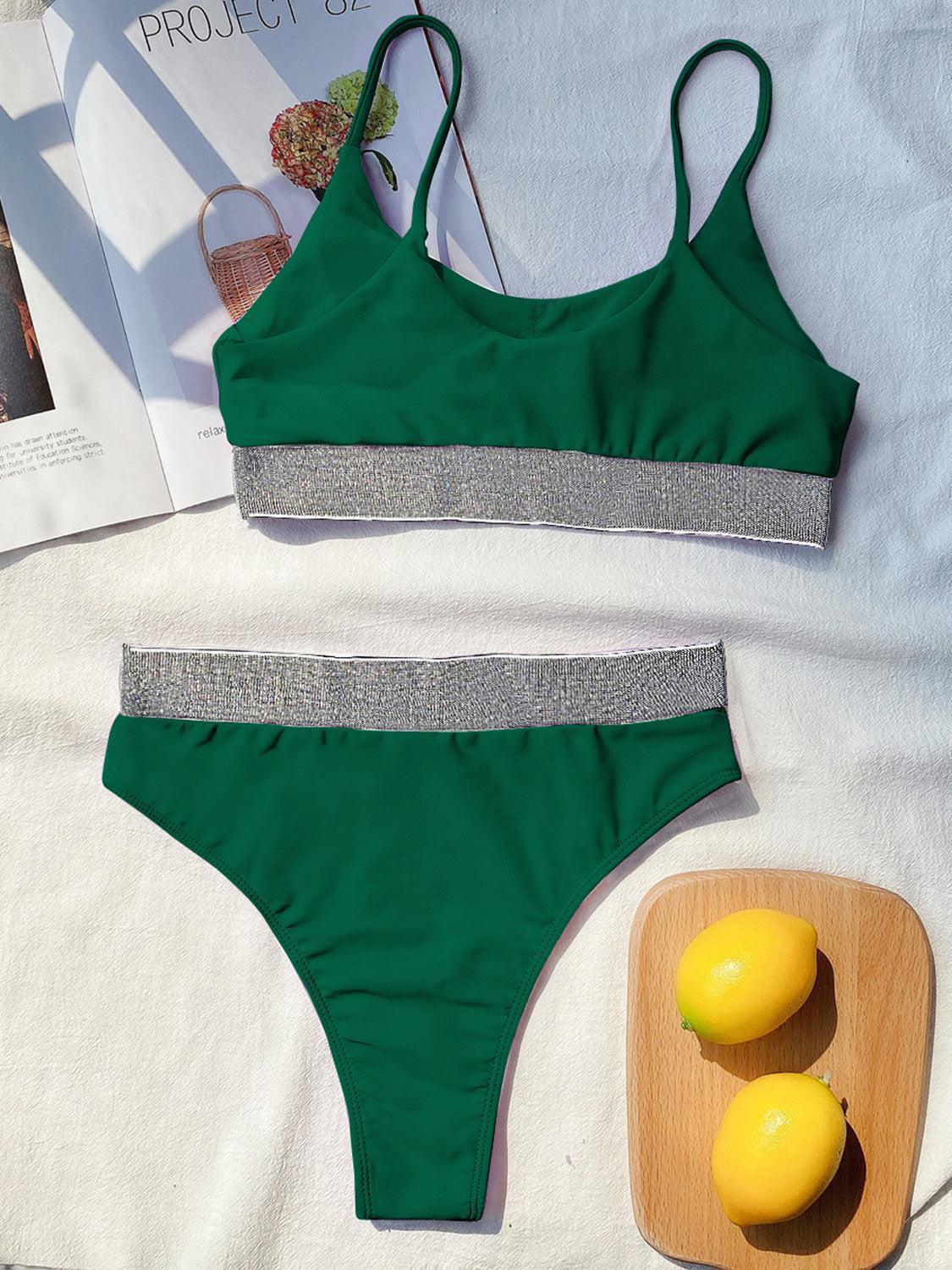 a woman's green bikinisuit and a lemon on a table