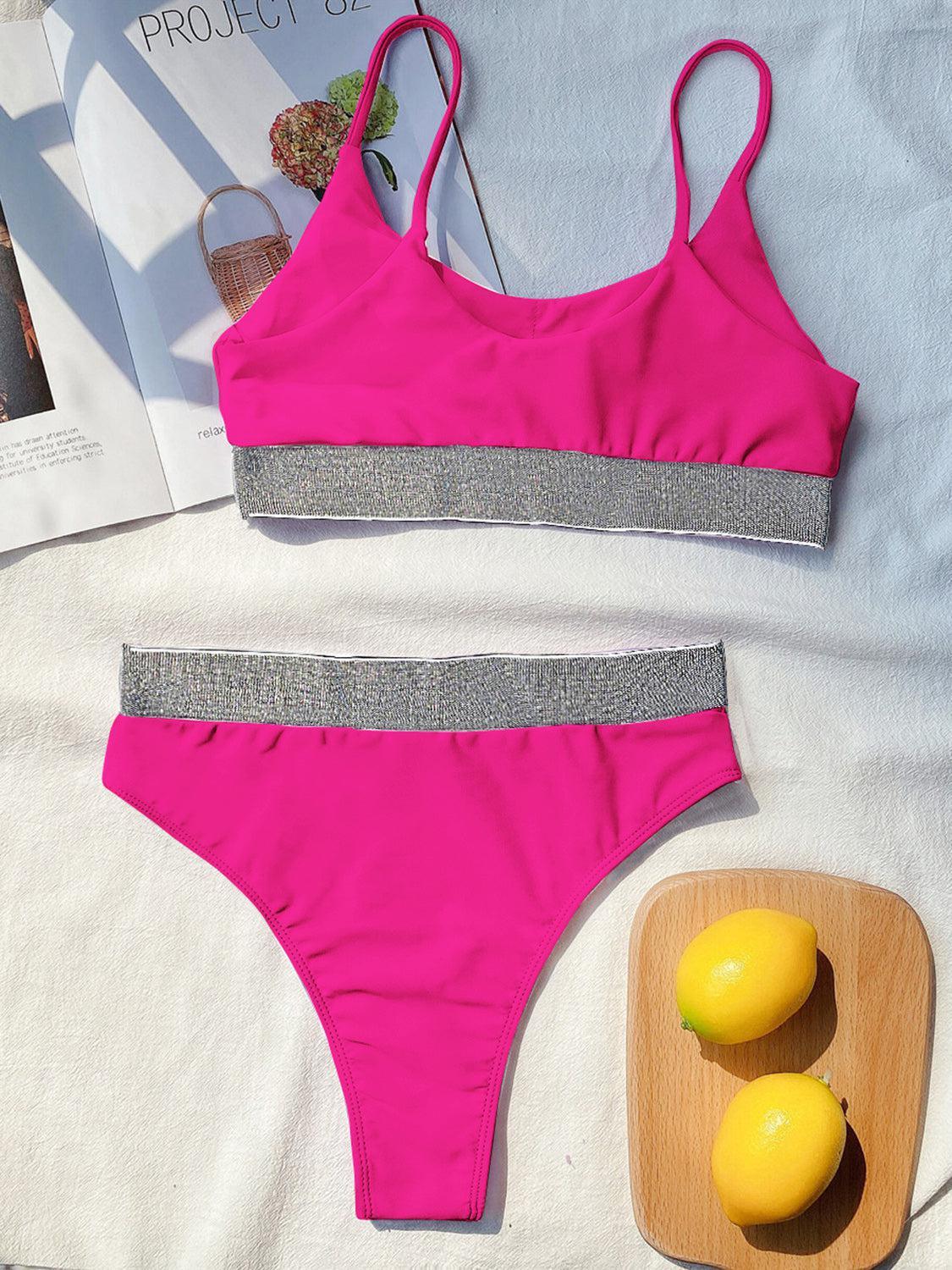 a woman's swimsuit and a lemon on a bed
