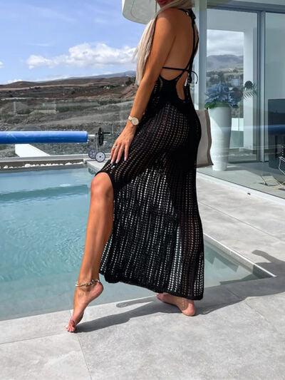 a woman in a black dress is standing near a pool