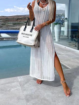 a woman in a white dress holding a white bag