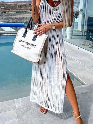 a woman in a white dress holding a white bag