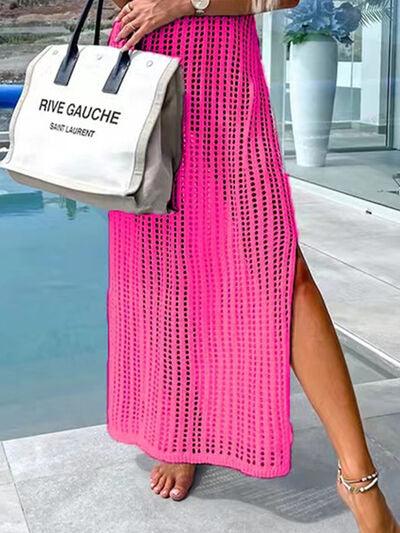 a woman in a pink dress holding a white bag