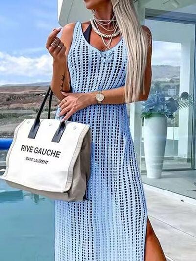 a woman in a blue dress holding a white bag