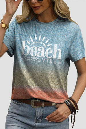 a woman wearing a beach vibes t - shirt