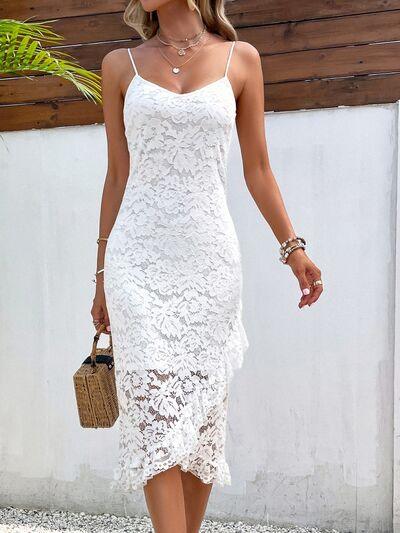 a woman wearing a white lace dress