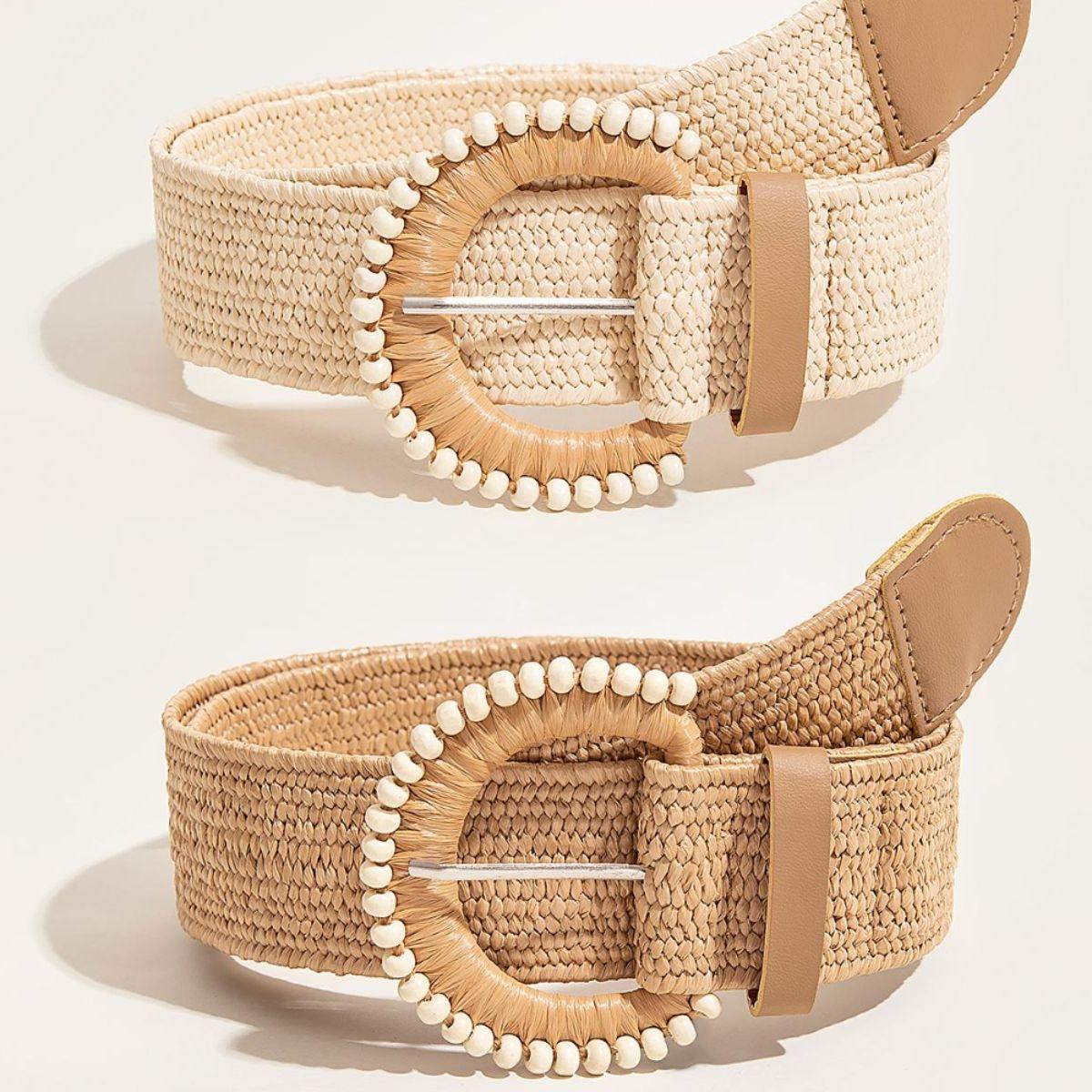 a pair of beige belts with pearls on them