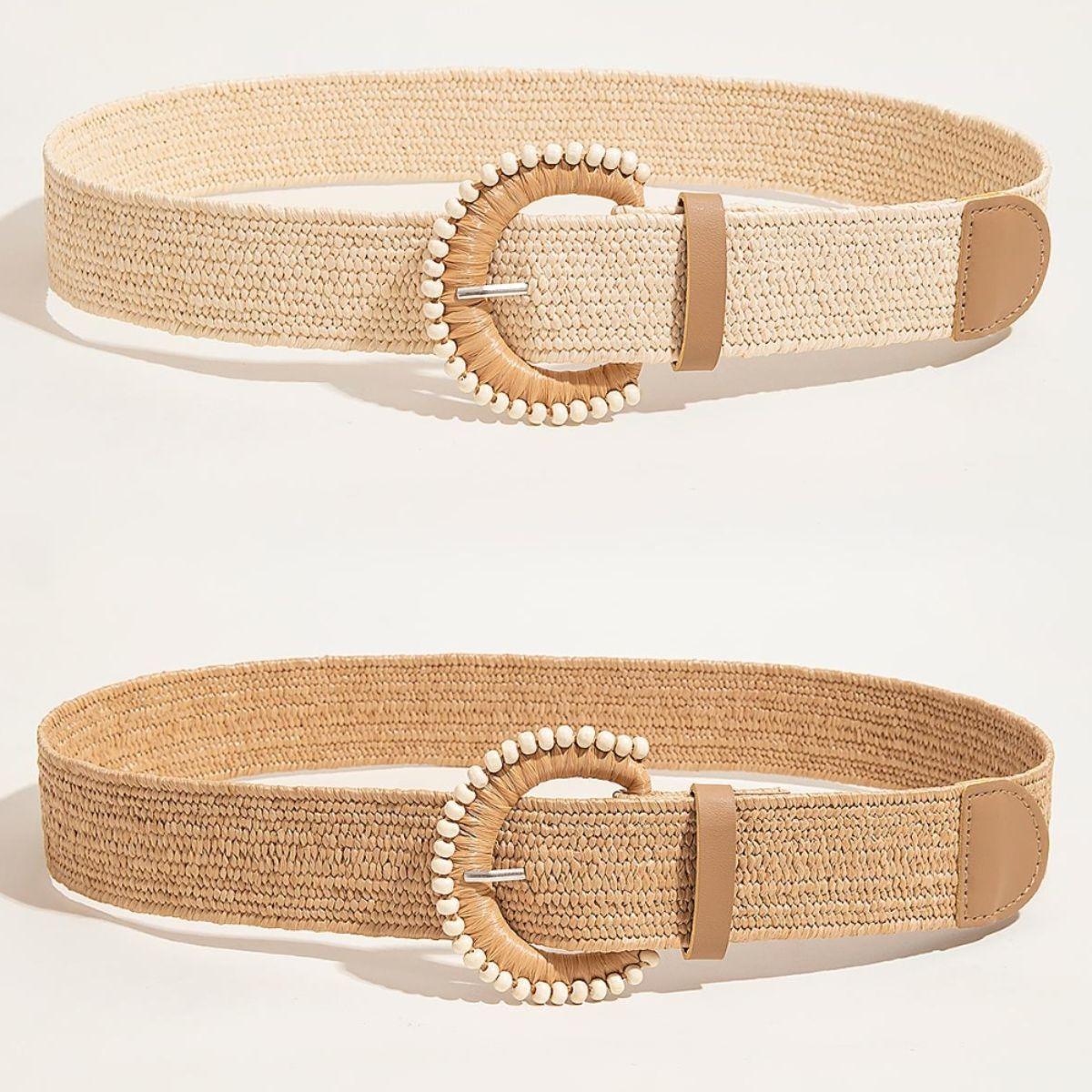 a pair of beige belts with beaded buckles