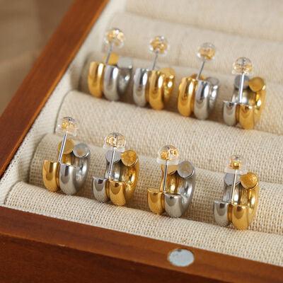 a set of five cufflinks in a wooden box