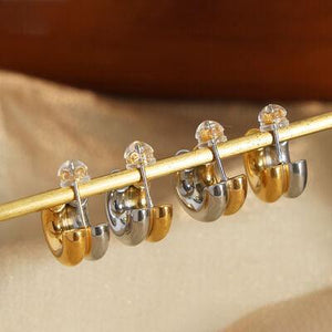 a close up of a gold and silver instrument