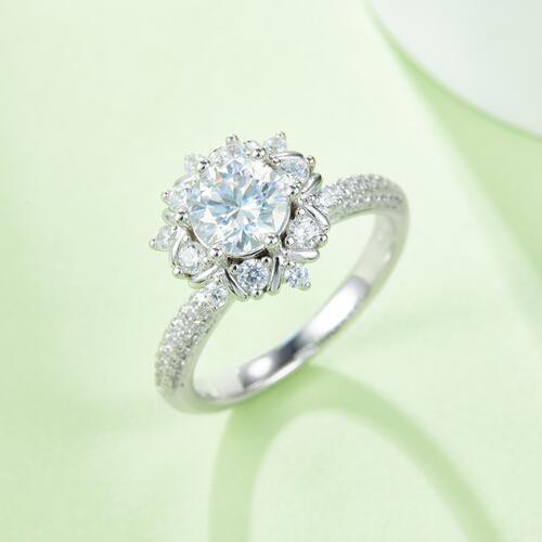 a diamond ring with a flower design on it