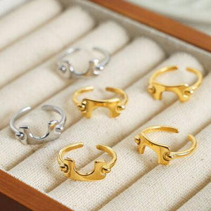 four pairs of gold and silver rings in a box