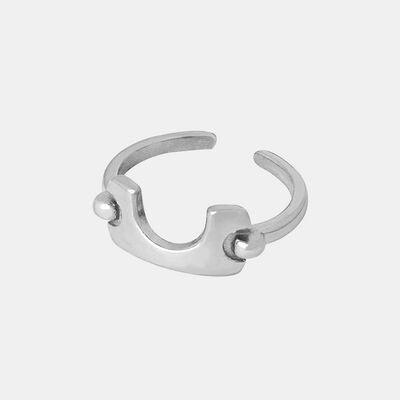 a silver ring on a white background