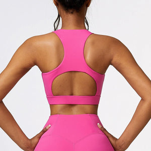 the back of a woman in a pink sports bra