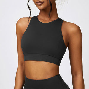 a woman in a black sports bra top