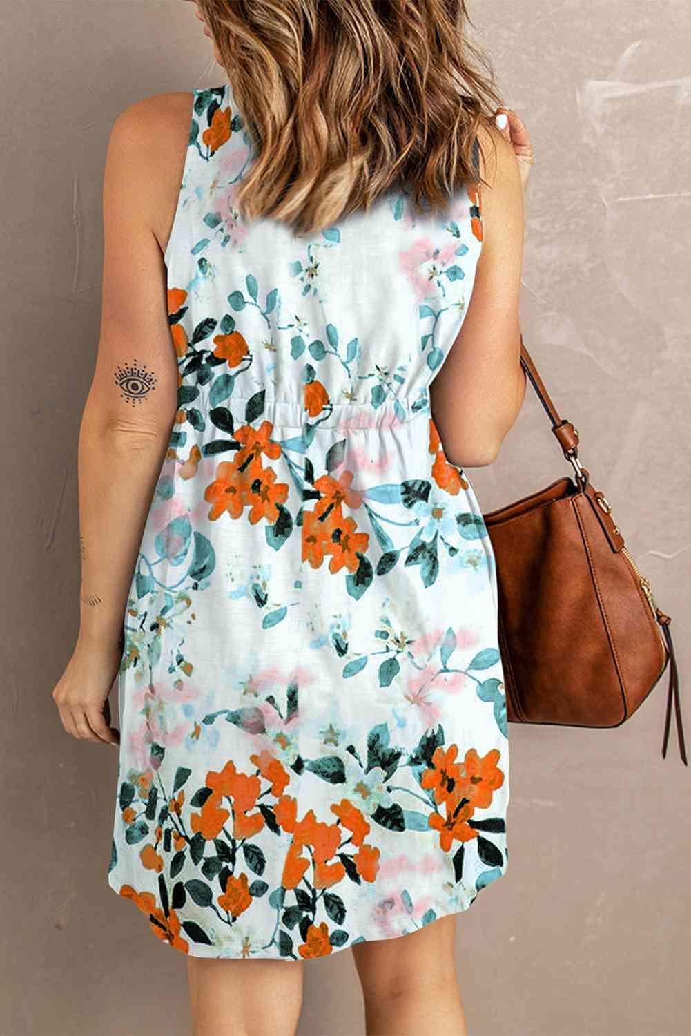 a woman in a floral dress holding a brown purse